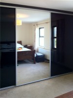 High gloss black sliding robe - fitted by Barrett Kitchens, Letterkenny, Co. Donegal, Ireland