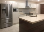 Gloss Ivory Kitchen with Gloss Walnut Island - design and installation by Barrett Kitchens, County Donegal, Ireland