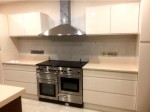 Gloss Ivory Kitchen with Gloss Walnut Island - design and installation by Barrett Kitchens, County Donegal, Ireland