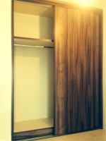 Fitted wood sliding wardrobe  - bedroom units designed and fitted by Barrett Kitchens, Donegal, Ireland