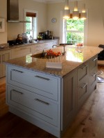 Hand painted in frame kitchen with central unit and granite tops, designed and fitted by Barrett Kitchens, Co. Donegal, Ireland