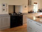 Hand painted in frame kitchen with central unit and granite tops, designed and fitted by Barrett Kitchens, Co. Donegal, Ireland