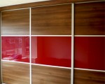 Sliding robe with mirror, red gloss and wood panels - bedroom units designed and fitted by Barrett Kitchens, Donegal, Ireland