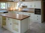 White hand painted in frame kitchen with central cupboard unit, designed and fitted by Barrett Kitchens, County Donegal, Ireland