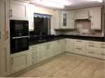 Hand-painted mussel kitchen, combined with dark worktops -  designed and fitted by Barrett Kitchens, Donegal, Ireland