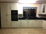 Hand-painted mussel kitchen, combined with dark worktops -  designed and fitted by Barrett Kitchens, Donegal, Ireland