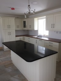 Solid Ivory island with black Quartz worktop