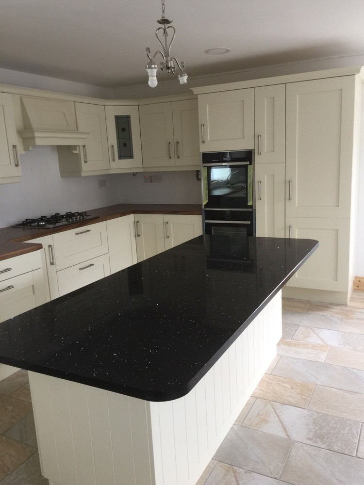 Albany Ivory painted kitchen with walnut  worktop on main kitchen and Quartz on island.