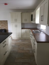 Albany Ivory painted kitchen with walnut worktop on main kitchen and Quartz on island