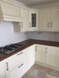 Albany Ivory painted kitchen with walnut worktop on main kitchen and Quartz on island