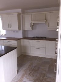 Albany Ivory painted kitchen with walnut worktop on main kitchen and Quartz on island