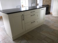 Albany Ivory painted kitchen with walnut worktop on main kitchen and Quartz on island